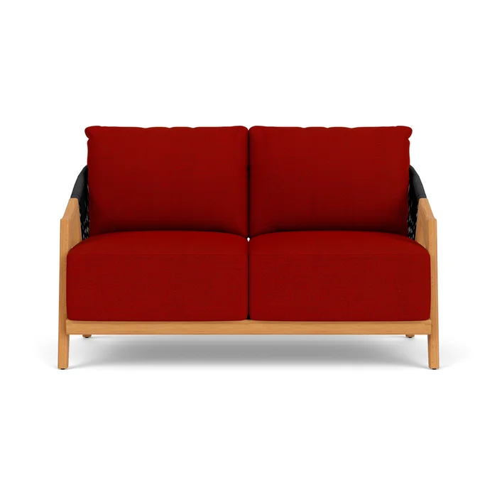 alpine loveseat in natural teak finish with partyline lollipop fabric grade b