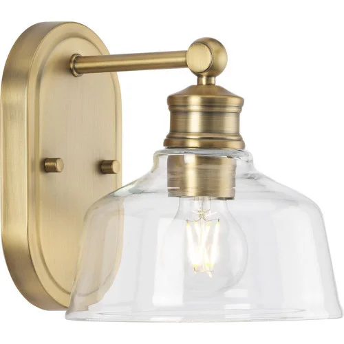 Singleton Collection One-Light 7.62” Vintage Brass Farmhouse Vanity Light with Clear Glass Shade (149|P300395-163)